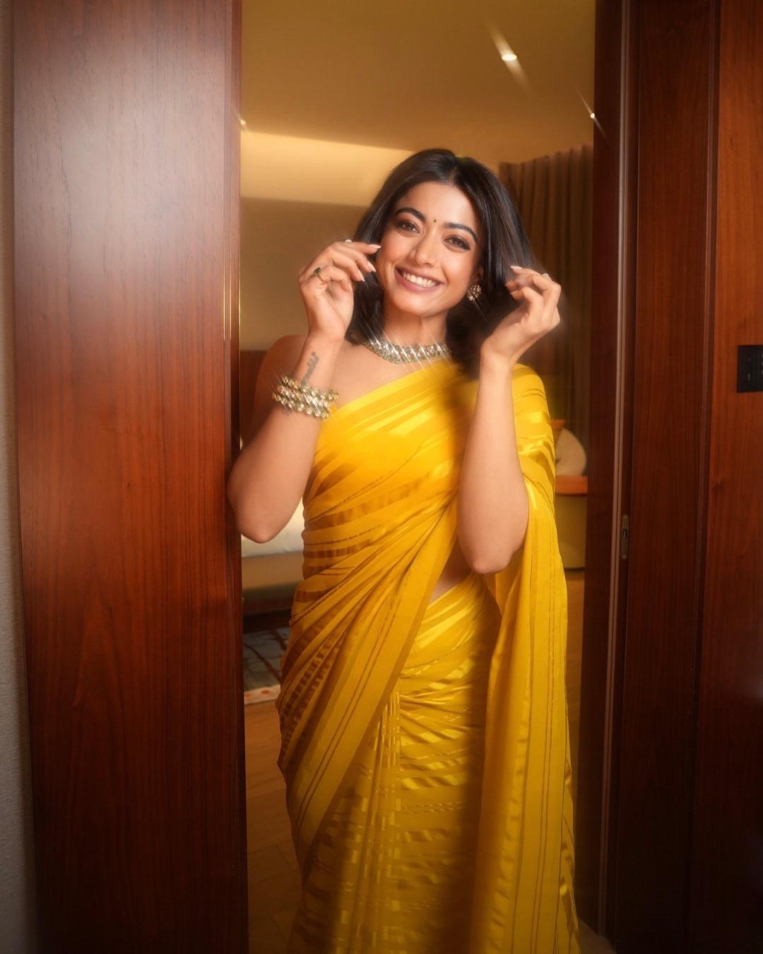Rashmika dazzled in a striking yellow-striped saree with deep yellow accents that gave it a rich touch