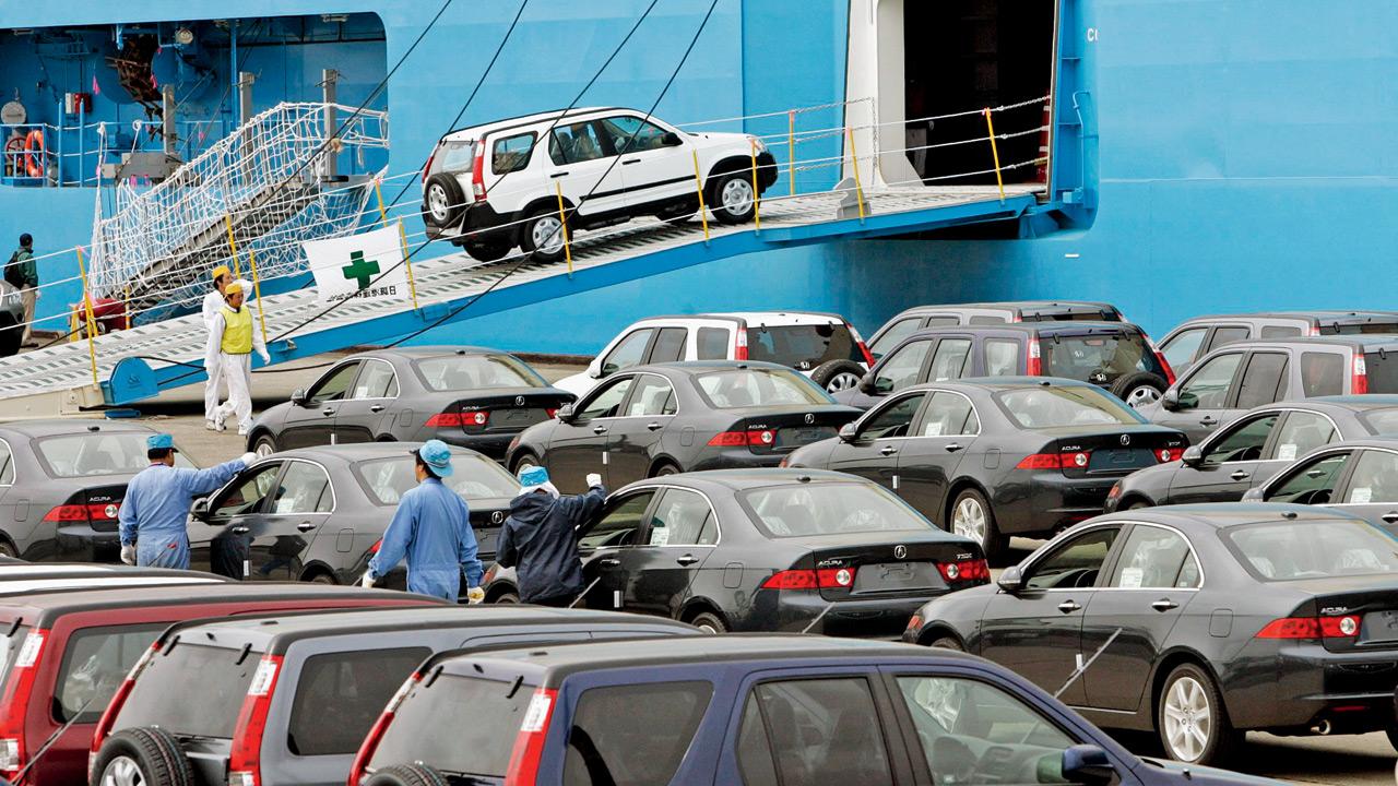 Honda’s passenger vehicles are loaded onto the cargo ship for export at the Chiba port in Narashino city, Japan. Pic/AFP