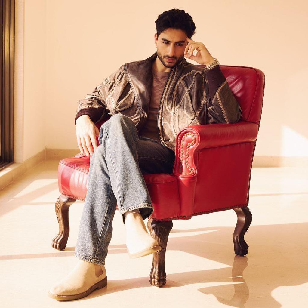He complemented the jacket with a textured brown woolen t-shirt, creating a perfectly layered and cozy ensemble