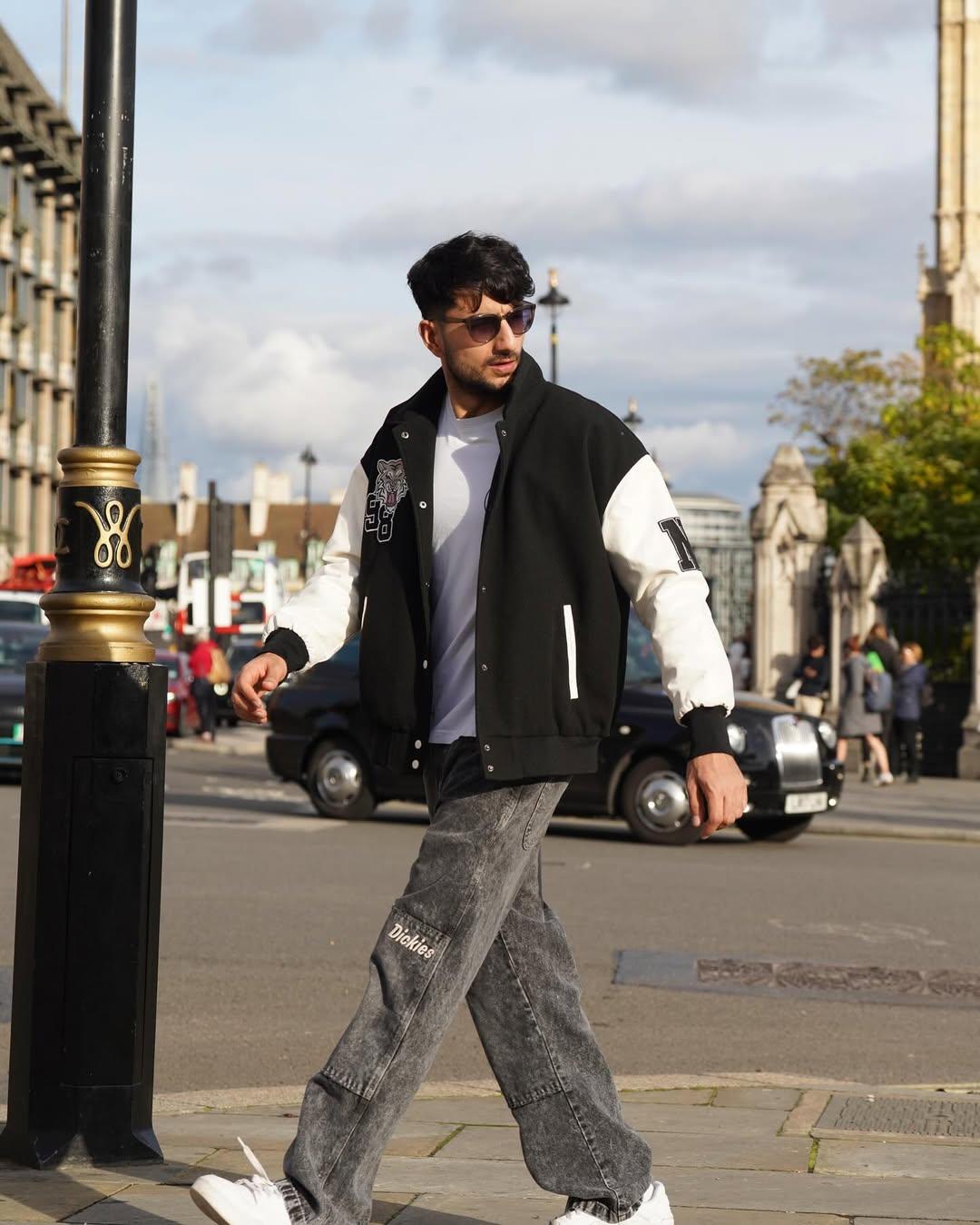Ibrahim Ali Khan nailed the street-style aesthetic by donning a black and white varsity jacket layered over a plain white t-shirt, creating a contrast