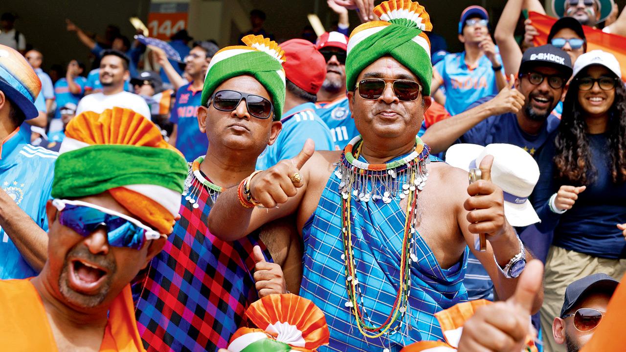 India fans cheer on during the ICC Champions Trophy final against New Zealand in Dubai yesterday. Pic/Getty Images