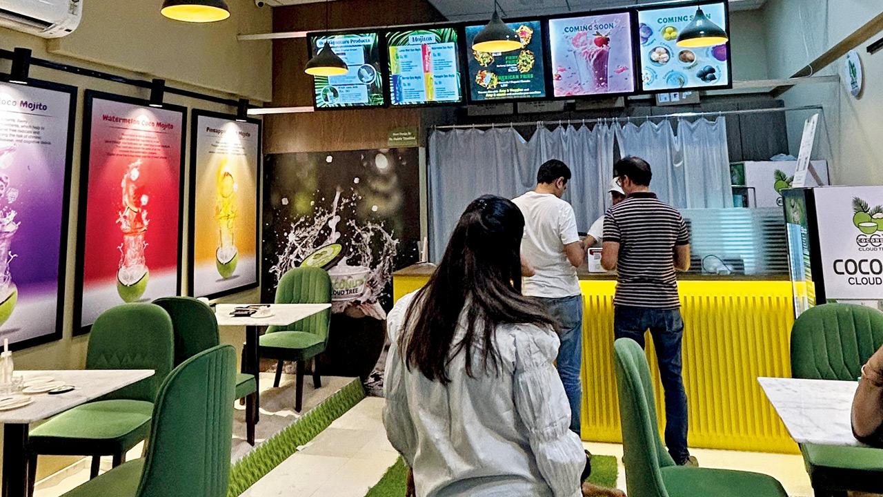 The indoor seating area has sand boxes below tables