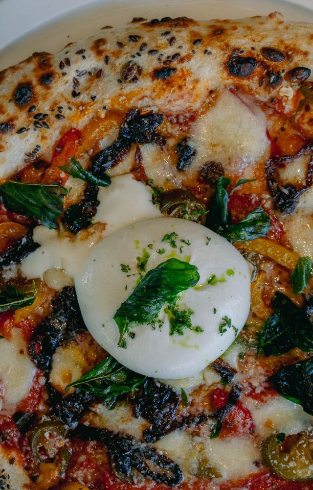 Among the additions to the menu is the Woodfired panuozzos which is made up of Basil Lemon Burrata and Grilled Chicken
