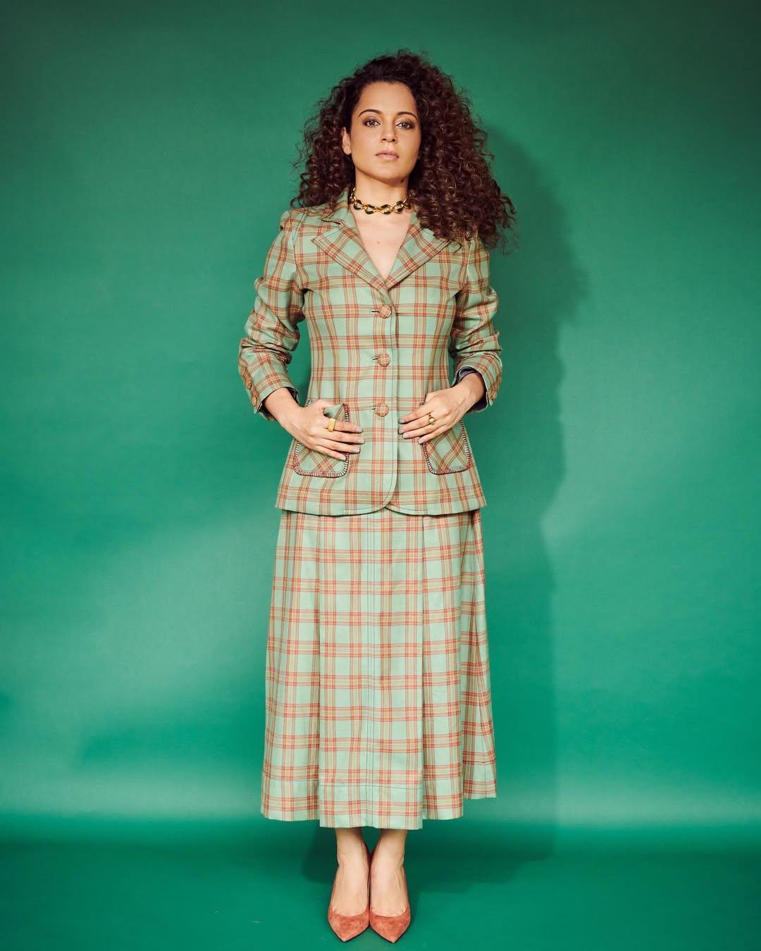 In this look, the actress stunned as she wore a green and brown checkered skirt and paired it with a matching blazer. The actress paired her dress with brown heels