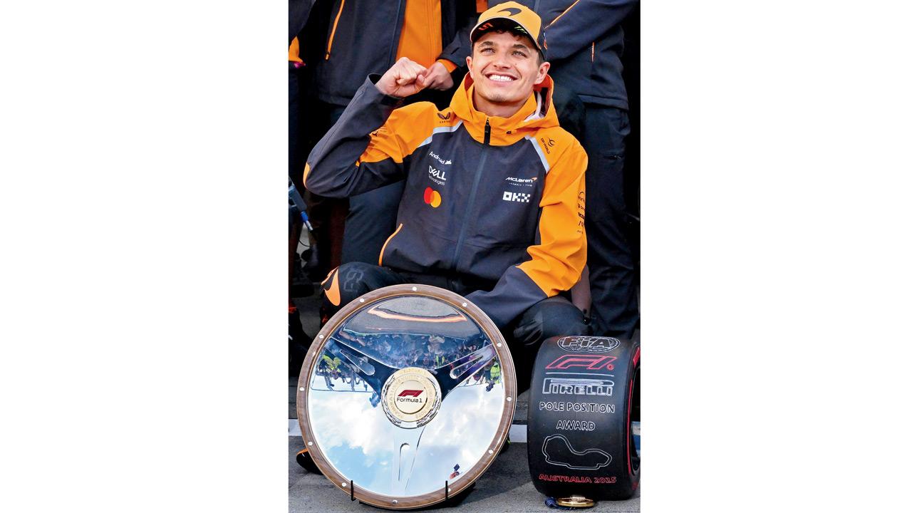 McLaren’s Lando Norris with the Australian GP winner’s trophy in Melbourne yesterday. Pics/Getty Images