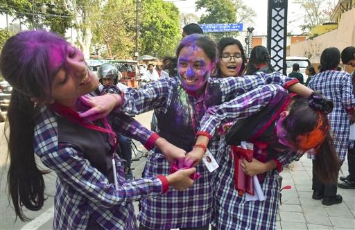 Students rejoice in Holi celebrations after completing their CBSE board class 10th exam, in Moradabad