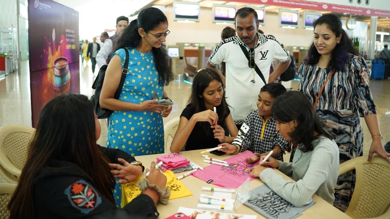 In Photos: Mumbai Airport celebrates Holi with colours, passenger engagement