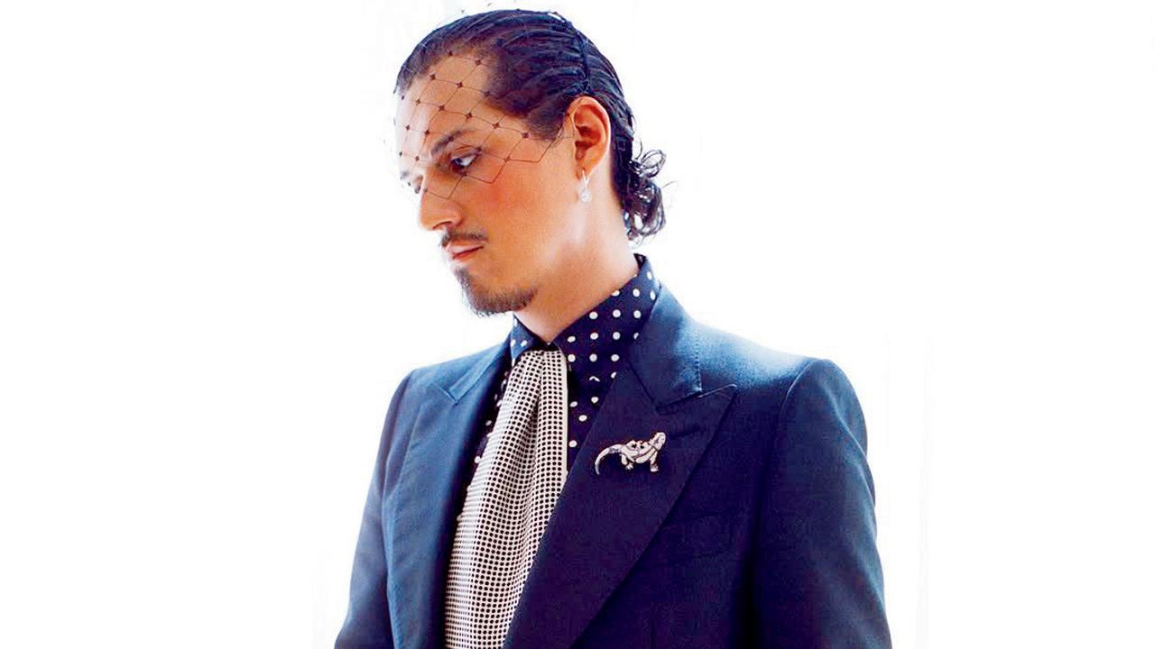 Omar Apollo dons a fishnet veil and fringed scarf with a brooch. PICS COURTESY/INSTAGRAM