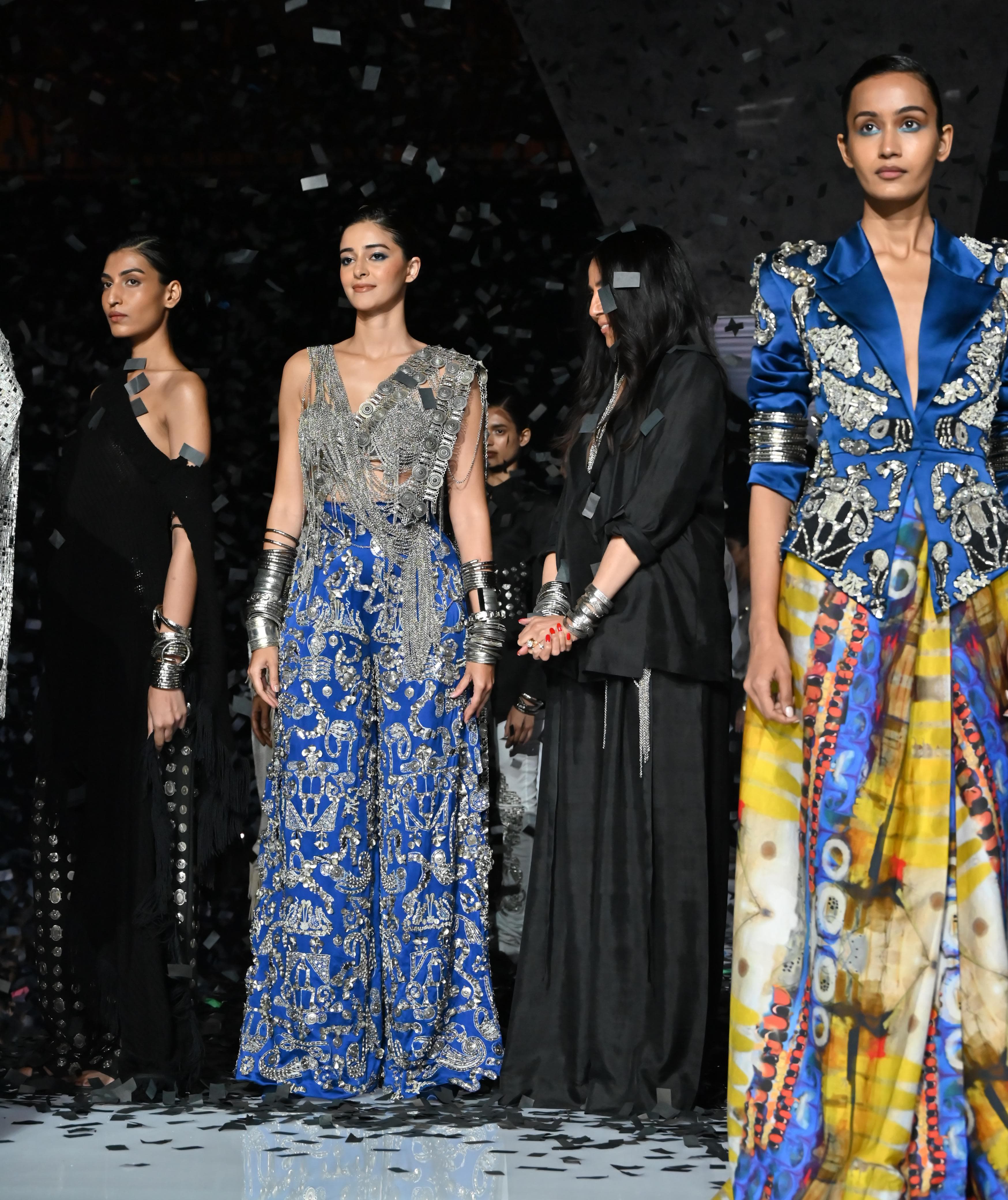 Her look was inspired by a modern twist on the Indian saree drape, portraying a strong, independent woman. Her effortless grace and commanding presence brought the collection to life, making for a truly unforgettable moment on the runway.