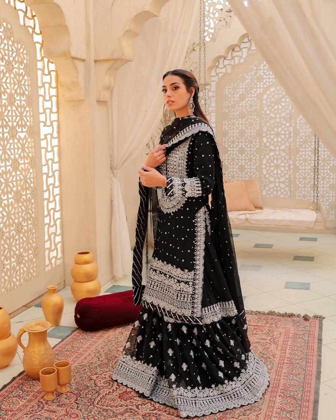 The actress wore a black kurta paired with a matching sharara and dupatta. Her outfit featured broad white borders and embroidery on the palazzo.