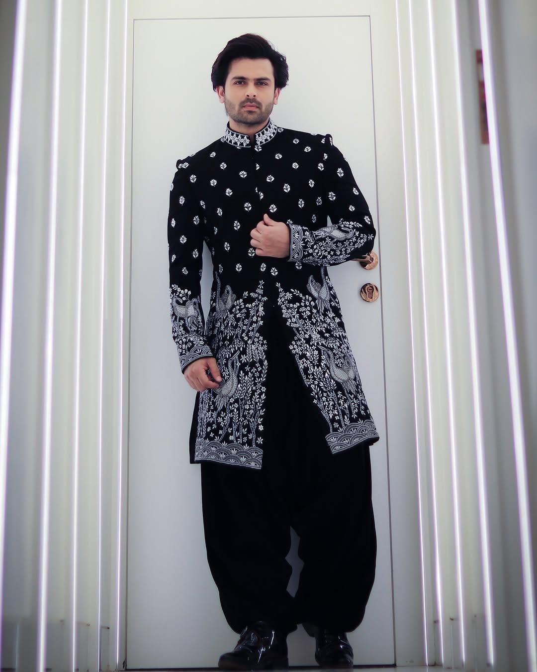 Wish to wear something even more grand? Then how about styling yourself in this black sherwani paired with matching Patiala?