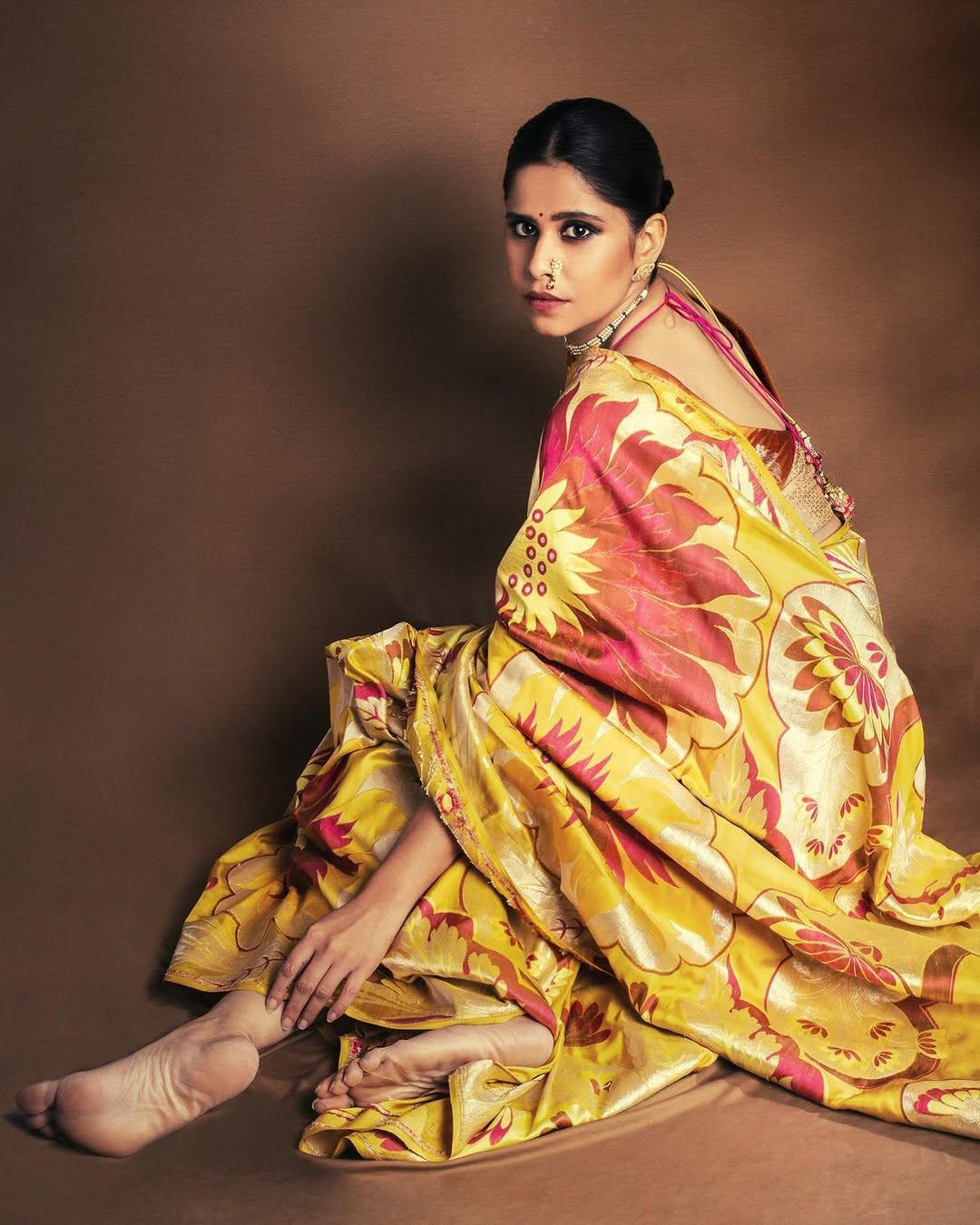 This picture has Sai slaying in a Marathi Mulgi avatar as she wore a stylish yellow saree featuring beautiful red prints all over it