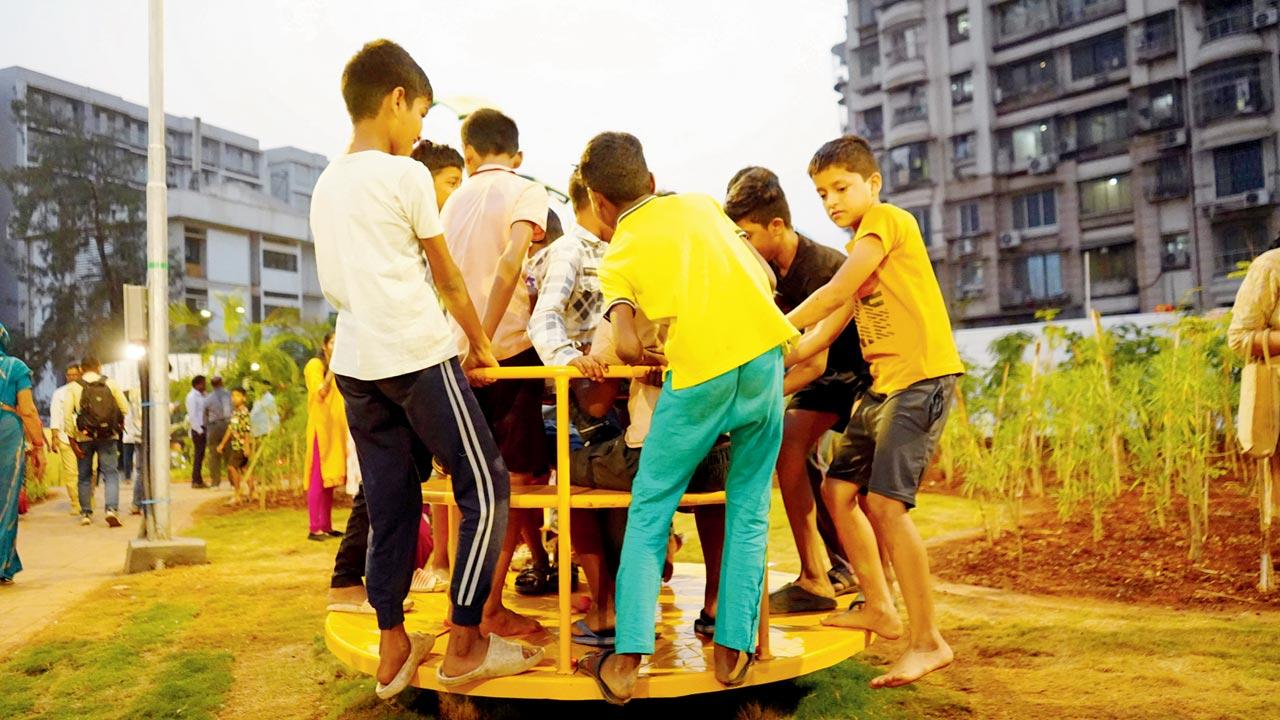 Children enjoy the new amenities in the garden