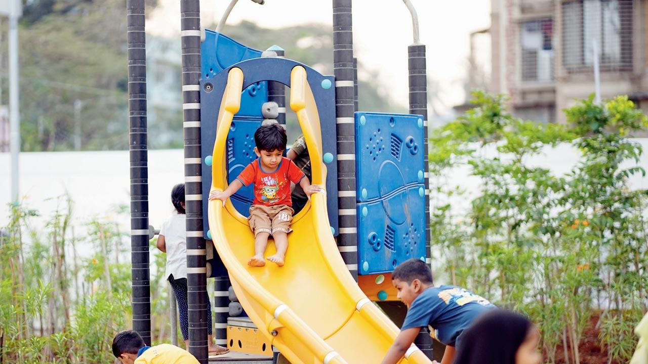 Children enjoy the new amenities in the garden