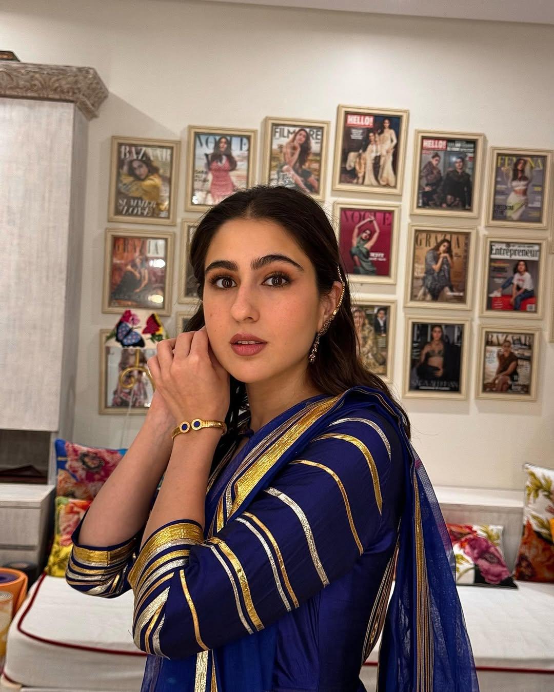 She paired it with a sheer dupatta and accessorized with statement earrings, a bracelet, a ring, while her kohl-rimmed eyes, glossy lips, and blushed cheeks enhanced her beauty