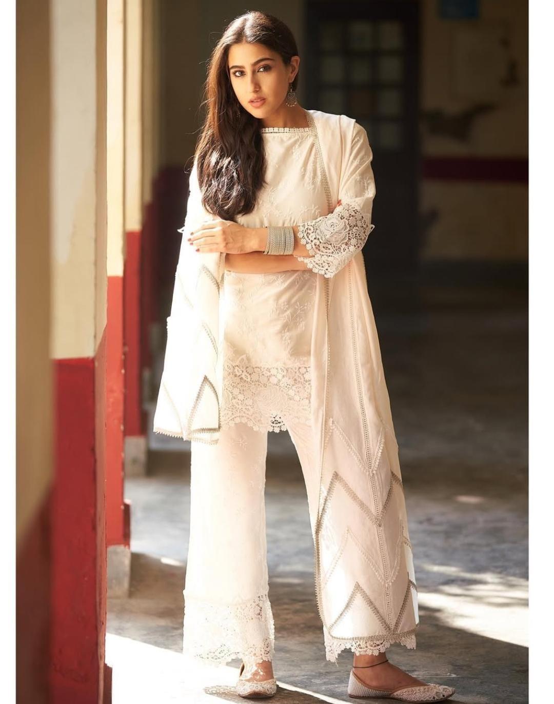 Sara stunned in an ivory cotton set by Mulmul, featuring a short kurta with intricate lace detailing, paired with a lace-trimmed palazzo