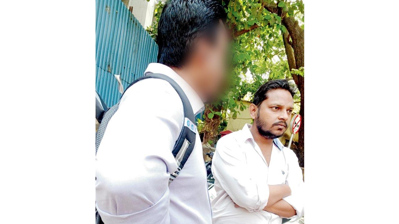 An agent (right) speaks to an applicant outside the tehsildar office of Kurla on SN Road in Mulund West on March 10. Pic/Rajesh Gupta