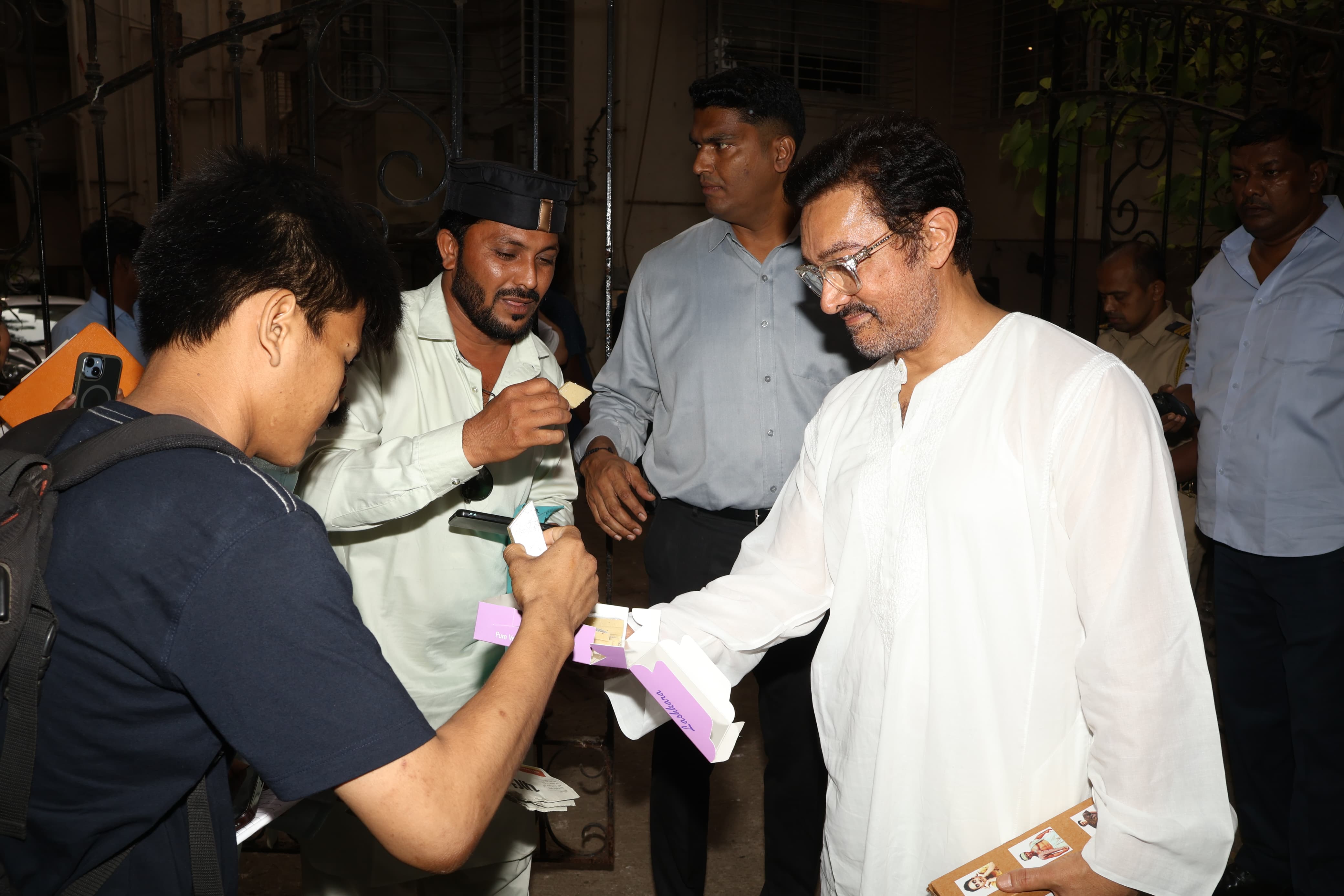 The actor also came to meet the paparazzi and offered them sweets as he wished them on Eid