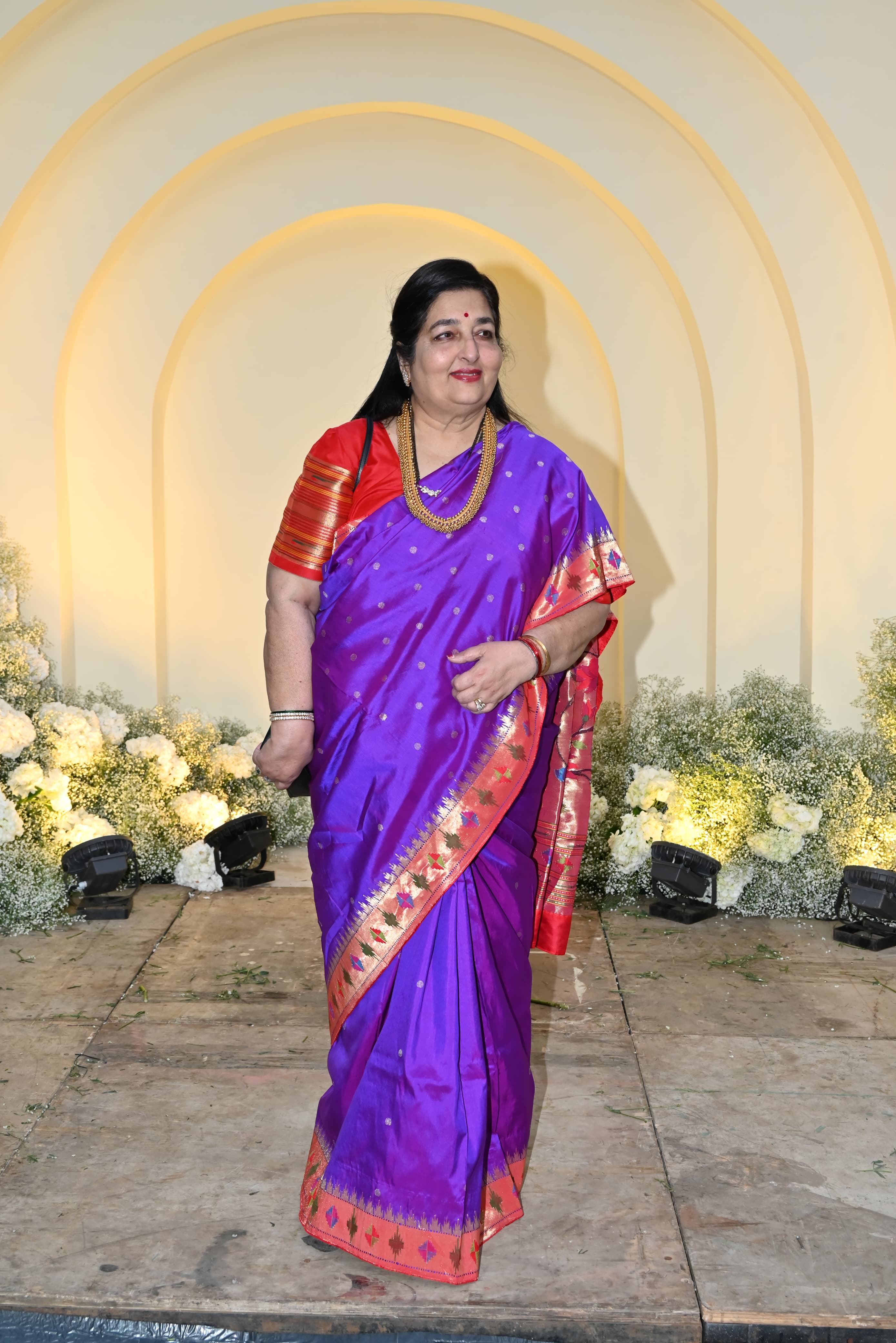 Veteran singer Anuradha Paudwal looked beautiful in a purple saree featuring a broad red border