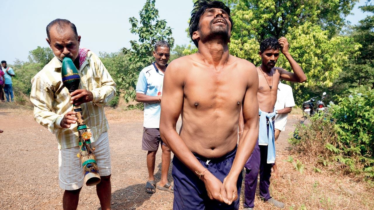 As an elder plays the tarpa, an adivasi wind instrument, the rhythm helps the men enter a hypnotic state. Next follows an animal sacrifice. The man in the foreground (shirtless) has to sacrifice a hen, but he must first enter a trance and find the bird in the jungle. “The sacrifices are important to keep the gods happy. They believe angry gods can result in famine, illness or drought,” says Saiyad