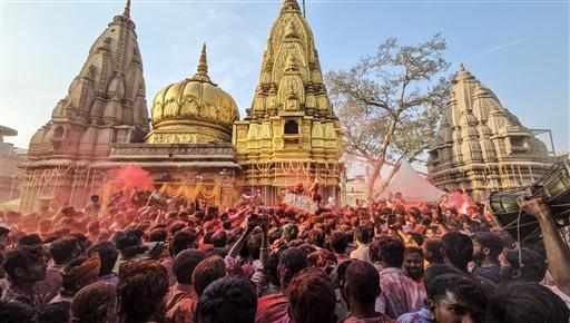 Vibrant Holi celebrations light up the Kashi Vishwanath temple premises, in Varanasi