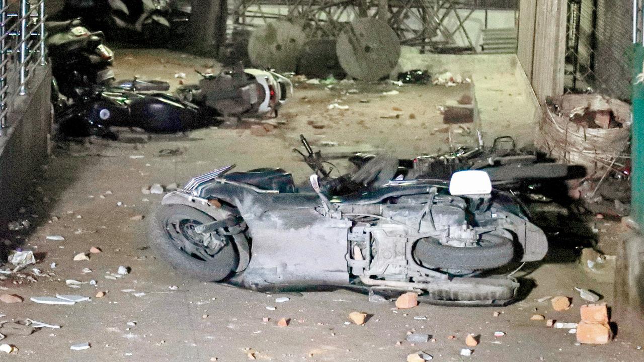 Vandalised vehicles in the Mahal area of Nagpur. Pic/PTI