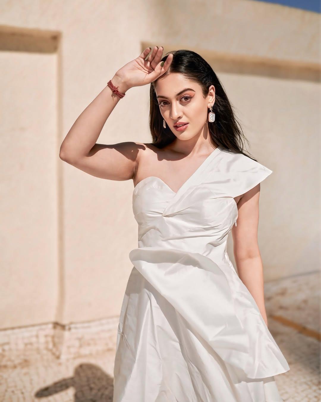 She further elevated her appearance by leaving her hair open, opting for glowy makeup, and accessorizing the look with white earrings