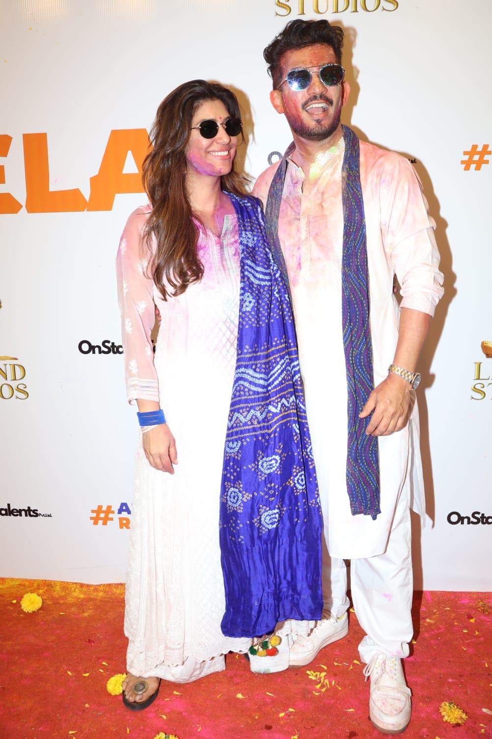 Arjun Bijlani and his wife Neha coordinated in a white kurta and blue dupatta at the grand Holi party