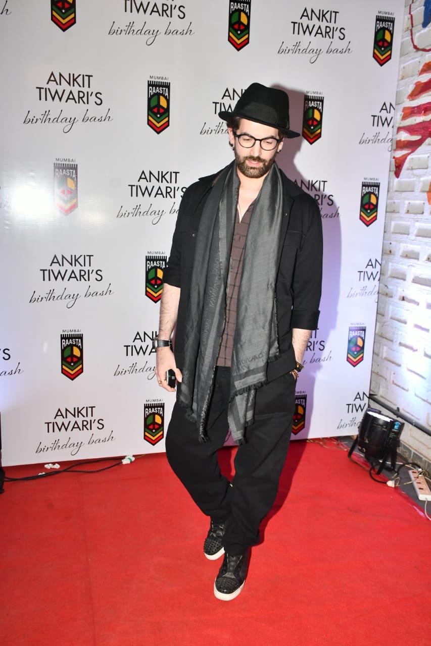 Neil Nitin Mukesh looked dashing in a brown T-shirt paired with black jeans and an overcoat as he attended Ankit Tiwari's birthday bash
