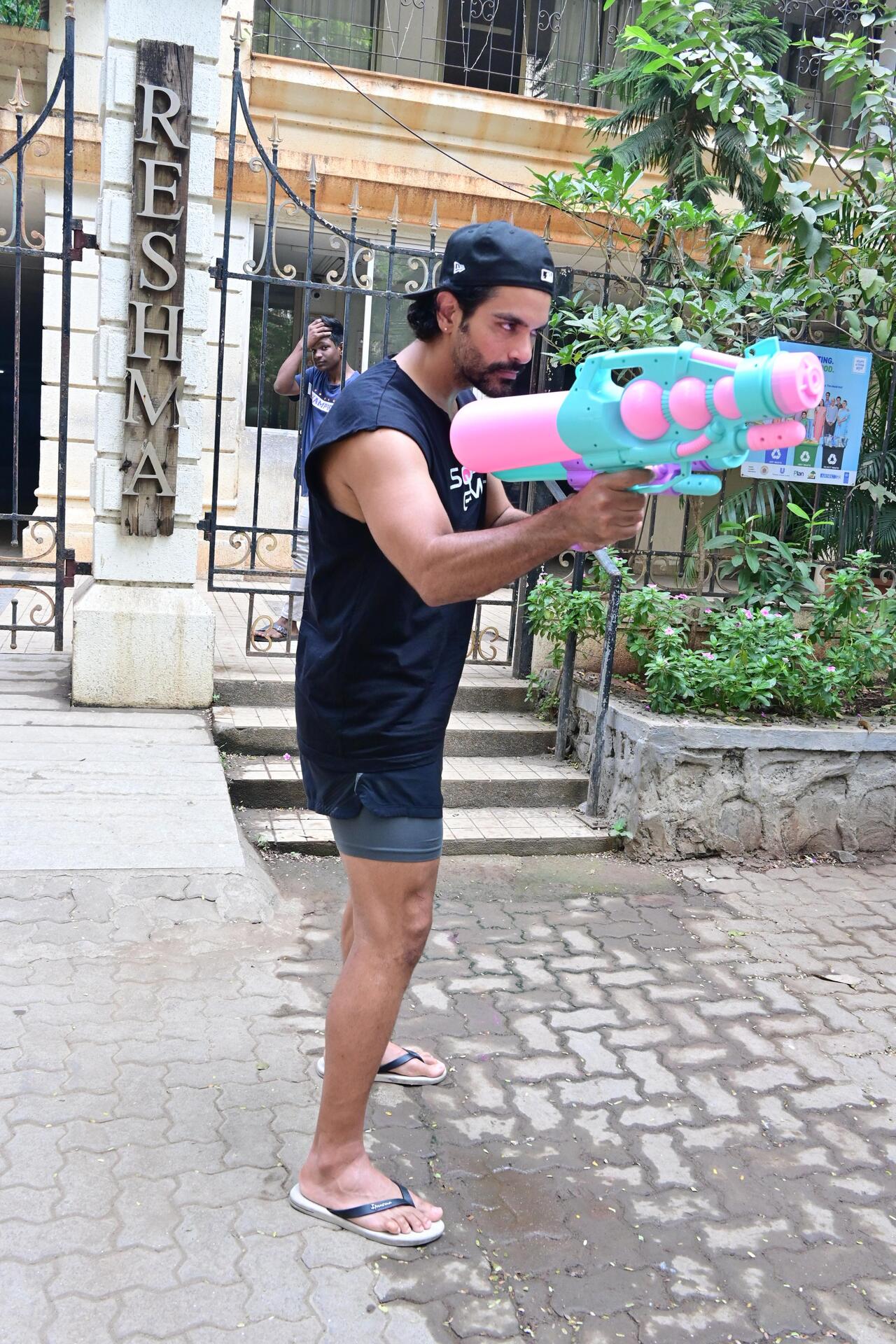 Angad Bedi was spotted in the city playing holi with a pichkari