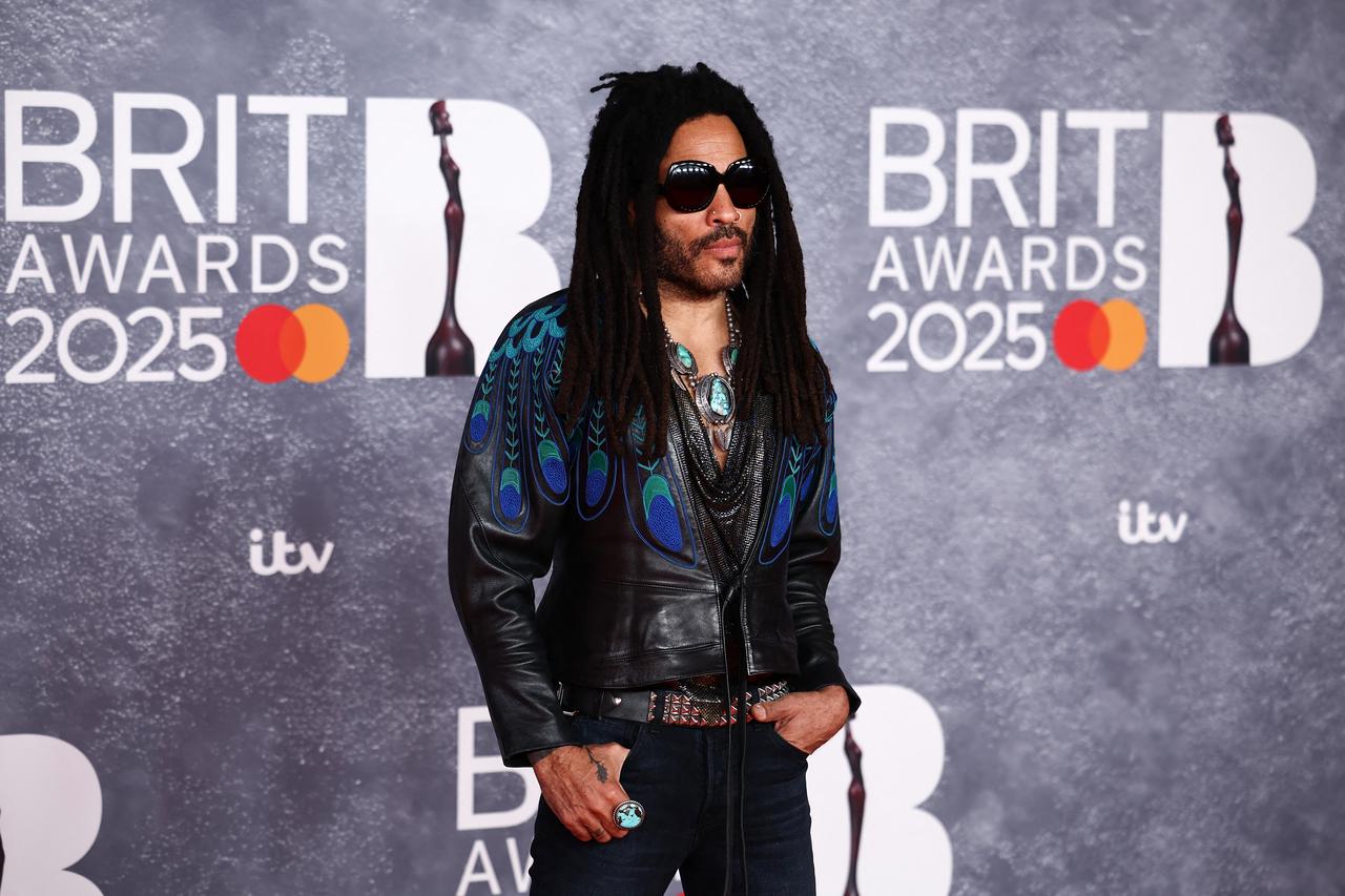 Singer Lenny Kravitz turned up in a peacock-printed leather jacket, paired with denims. 