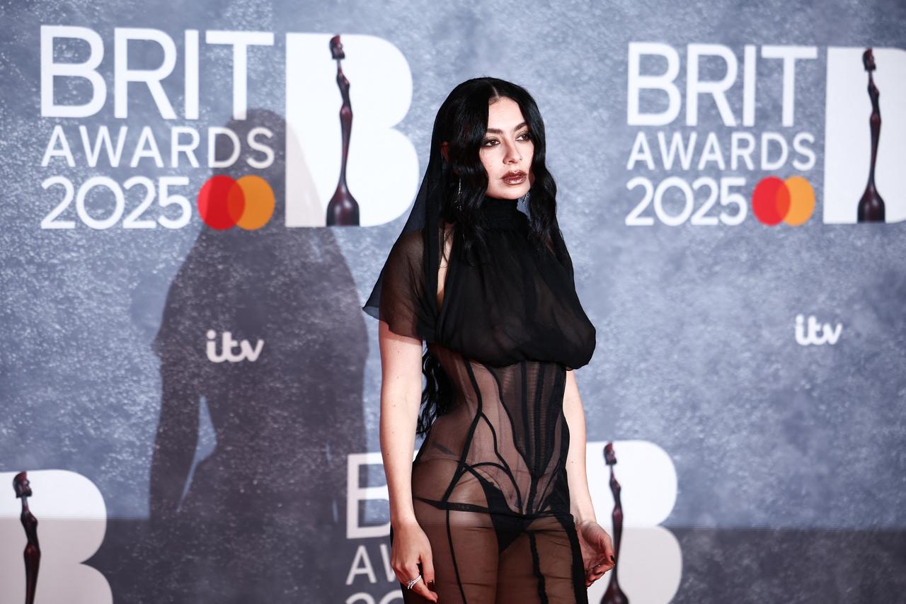 The singer-songwriter turned heads in a racy black sheer outfit that turned heads on the red carpet.