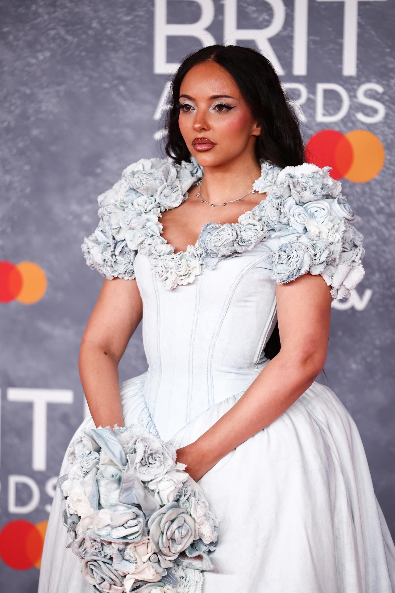 Singer Jade walked the red carpet in a pale blue, drop waist, denim bridal gown which included a floral design. 