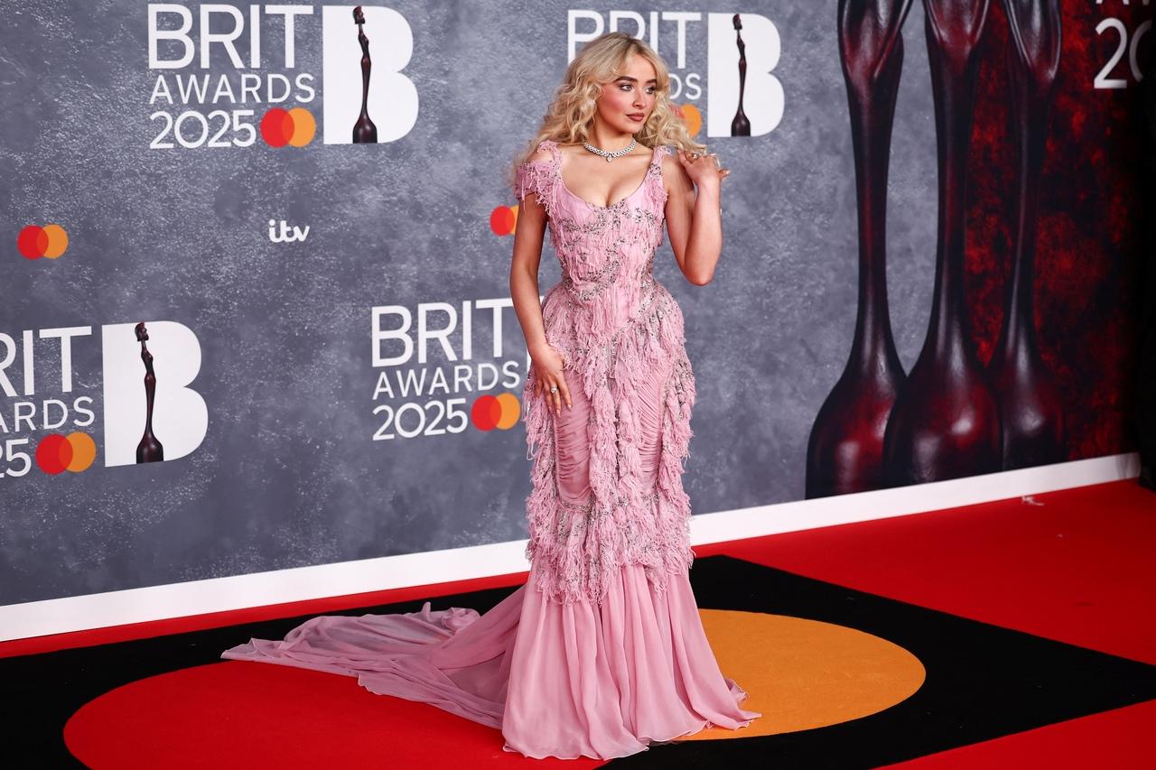 The outfit was embellished with tassels, sequin detailing, and a plunging neckline. 