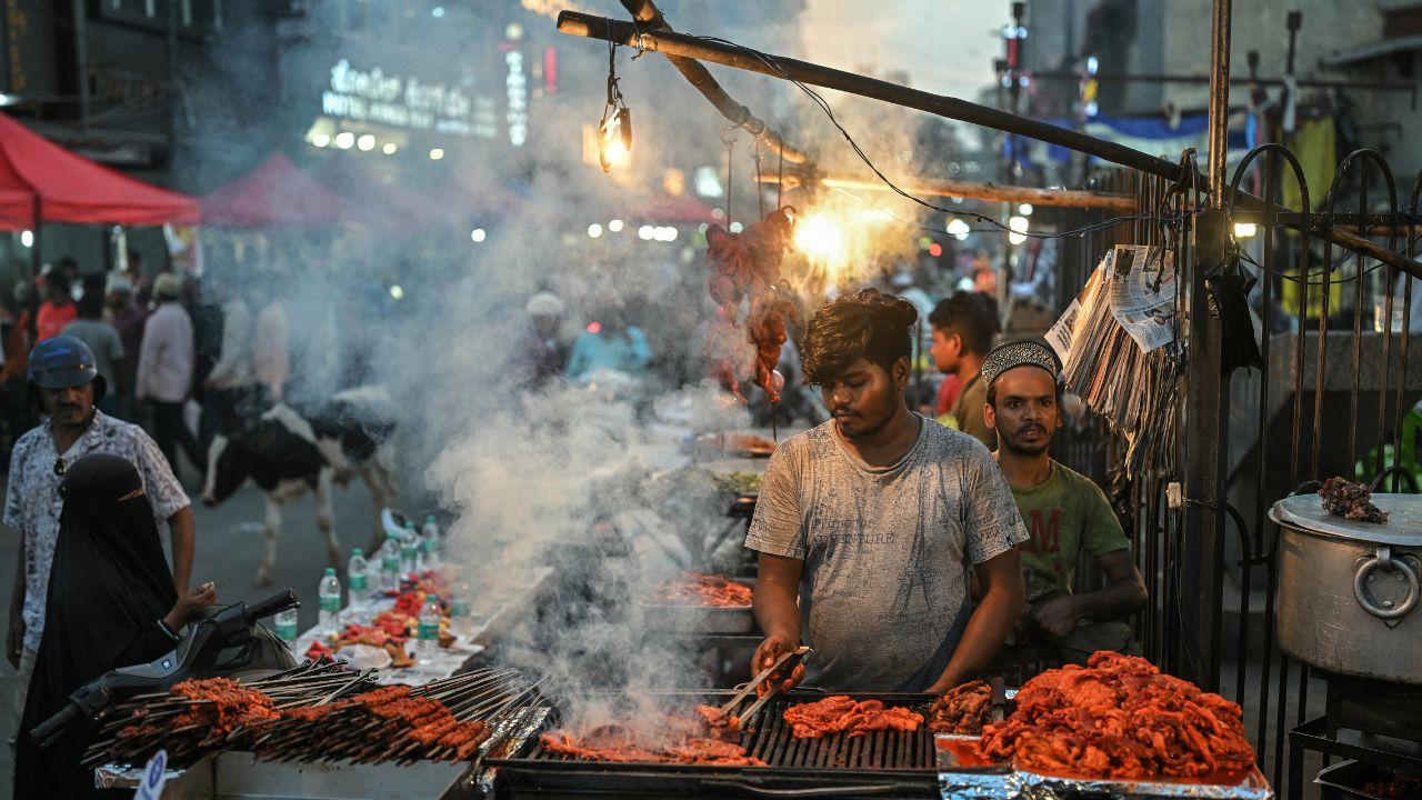 Vendor cooks seekh kebabs on skewers as he prepares for iftar during the Islamic holy fasting month of Ramadan in Bengaluru
