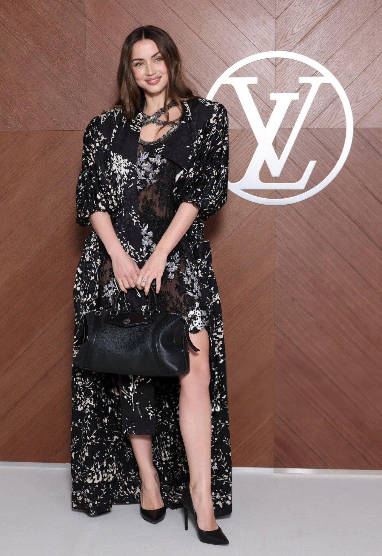 Ana de Armas wore a printed sheer outfit with a mammoth shrug layered on top. 