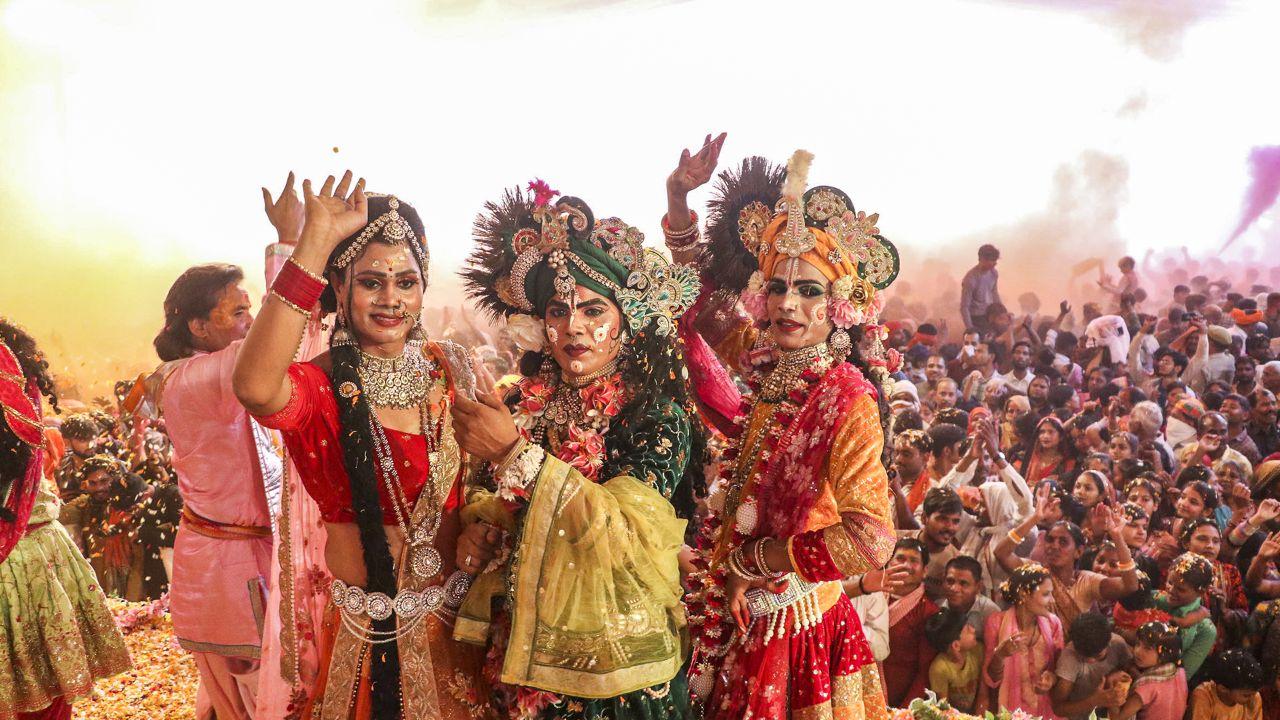 Devotees dressed as Radha and Krishna attend Holi celebrations at Sri Krishna Janmasthan temple Mathura on Monday