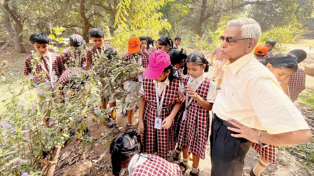 Dr Chandrakant Lattoo guides children during an earlier tree walk