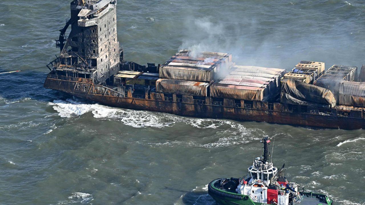 Hazardous fumes from damaged containers on the deck of the cargo ship 