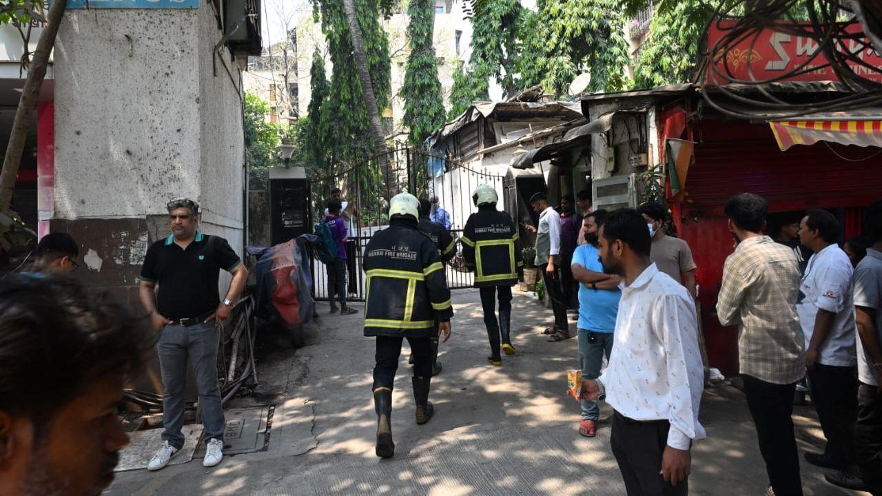 Visuals show firefighters entering the building's entrance