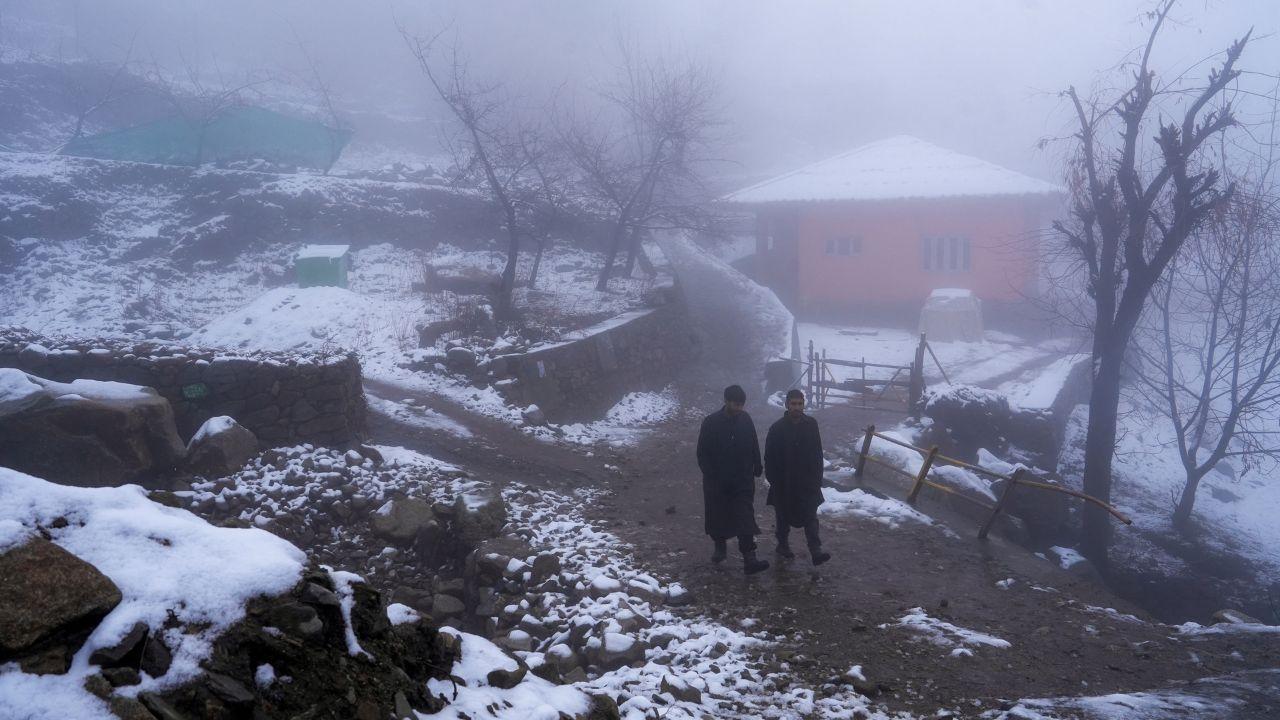 The outskirts of Srinagar is covered with fog and snowfall