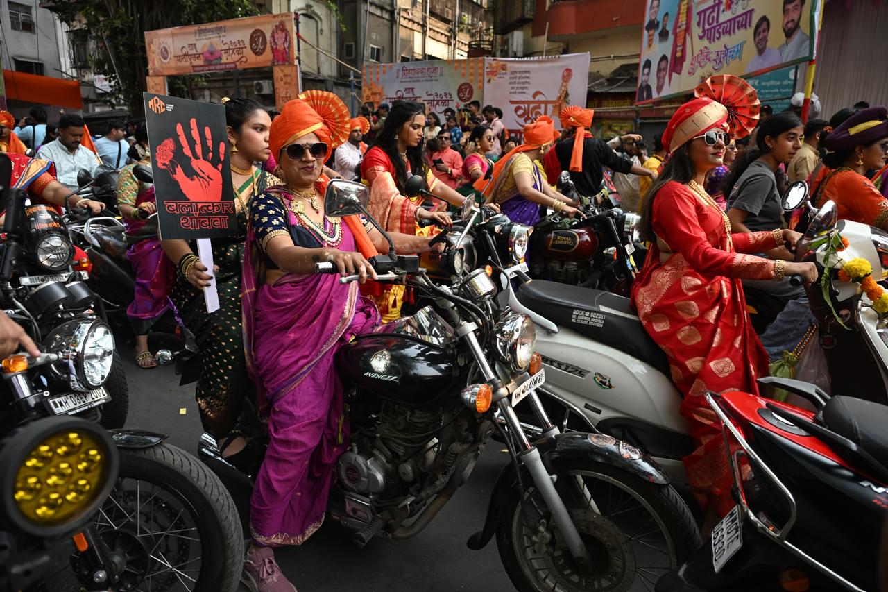 Women dress in nauvari sarees, while men wear dhotis and pagris, adding to the festive spirit.