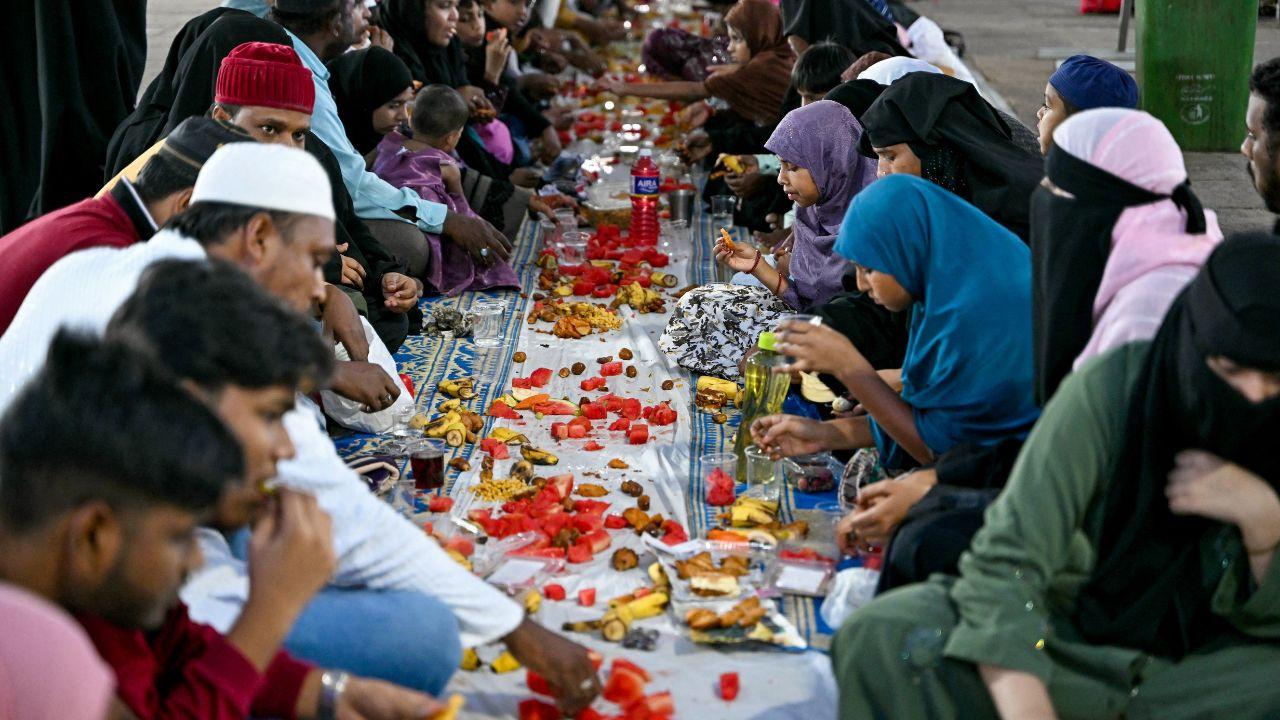 Devotees break their fast with iftar meals at a mosque in Chennai 