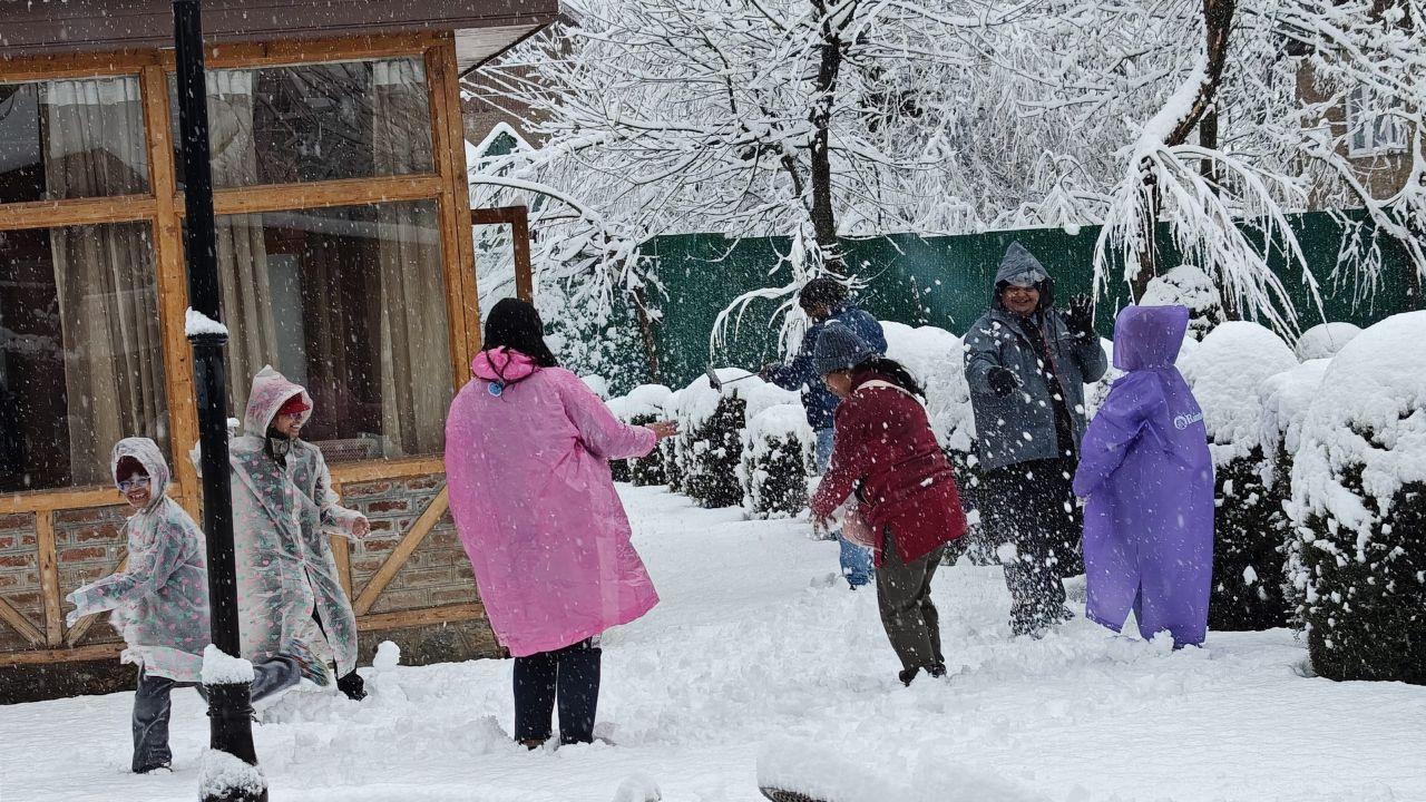 Many tourists gather to play with snow after a fresh spell of snowfall, in Pahalgam, Jammu and Kashmir