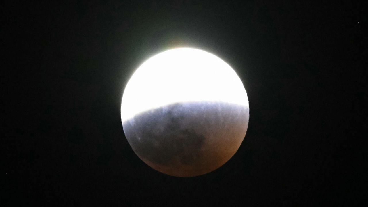 Throughout the event, people across the globe gathered to witness the moon's transformation, with the celestial body shifting from a bright white to a dark, ominous red