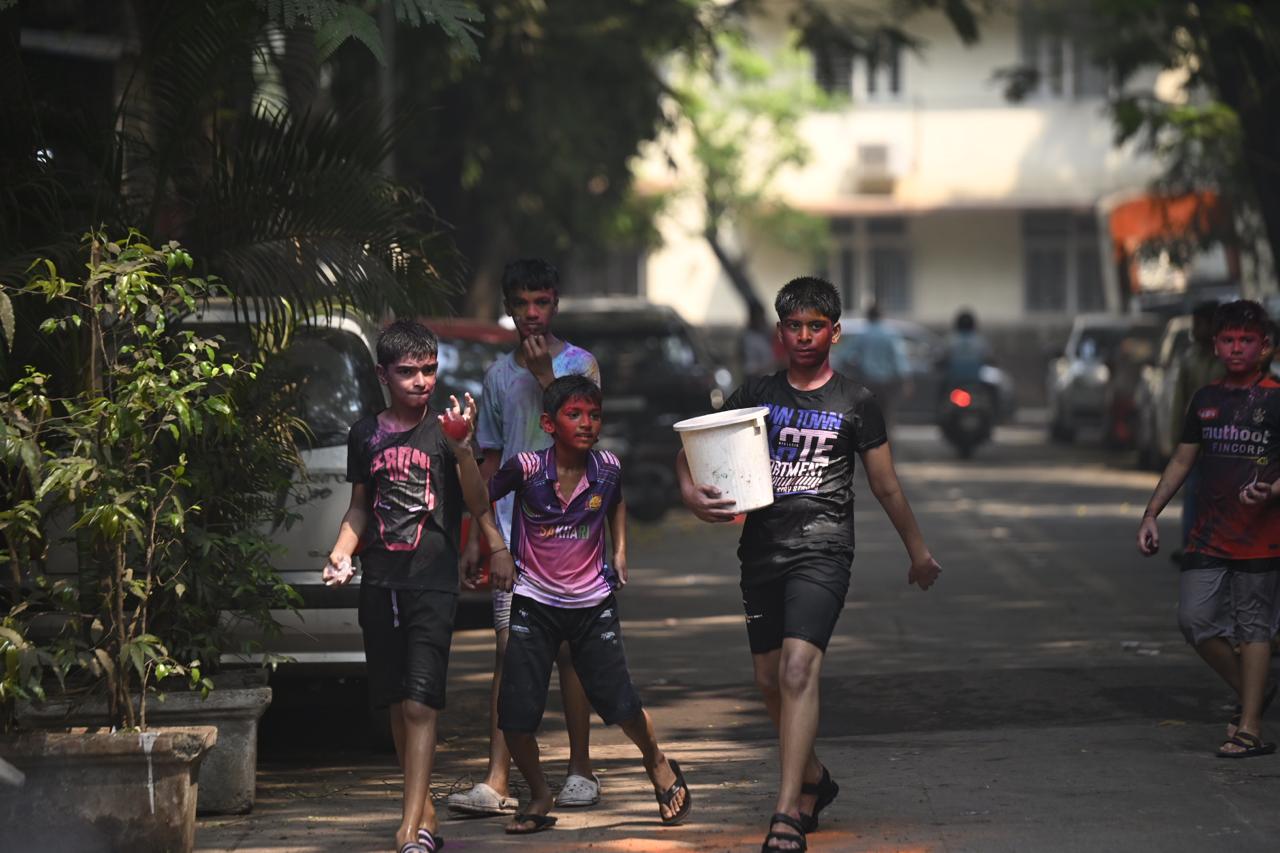 Children eagerly took part in Holi games, armed with water guns and coloured powders.