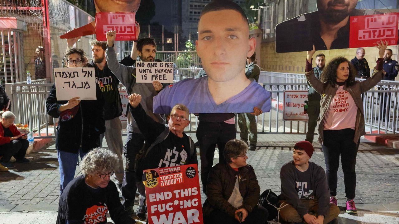 The family members and friends of Israelis held hostages sat outside tents set up around the Defence Ministry in Tel Aviv. Pics/AFP