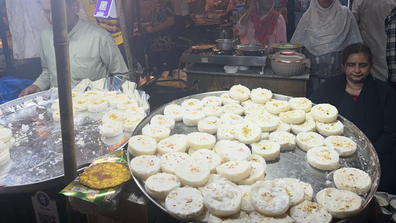 Dishes like rice cakes topped with malai and mawa attract long queues at the stalls