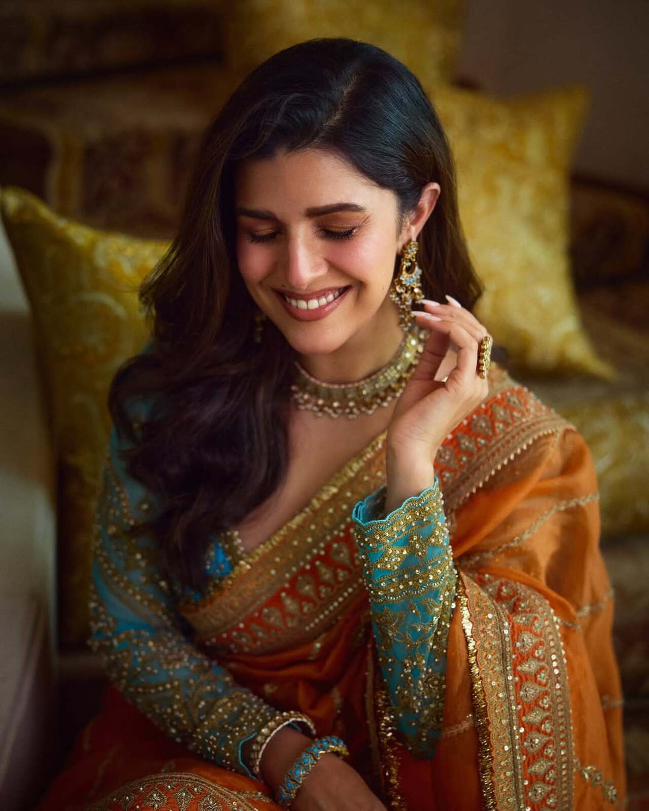 Nimrat went complete desi and gave a royal touch with this orange and blue saree by Torani