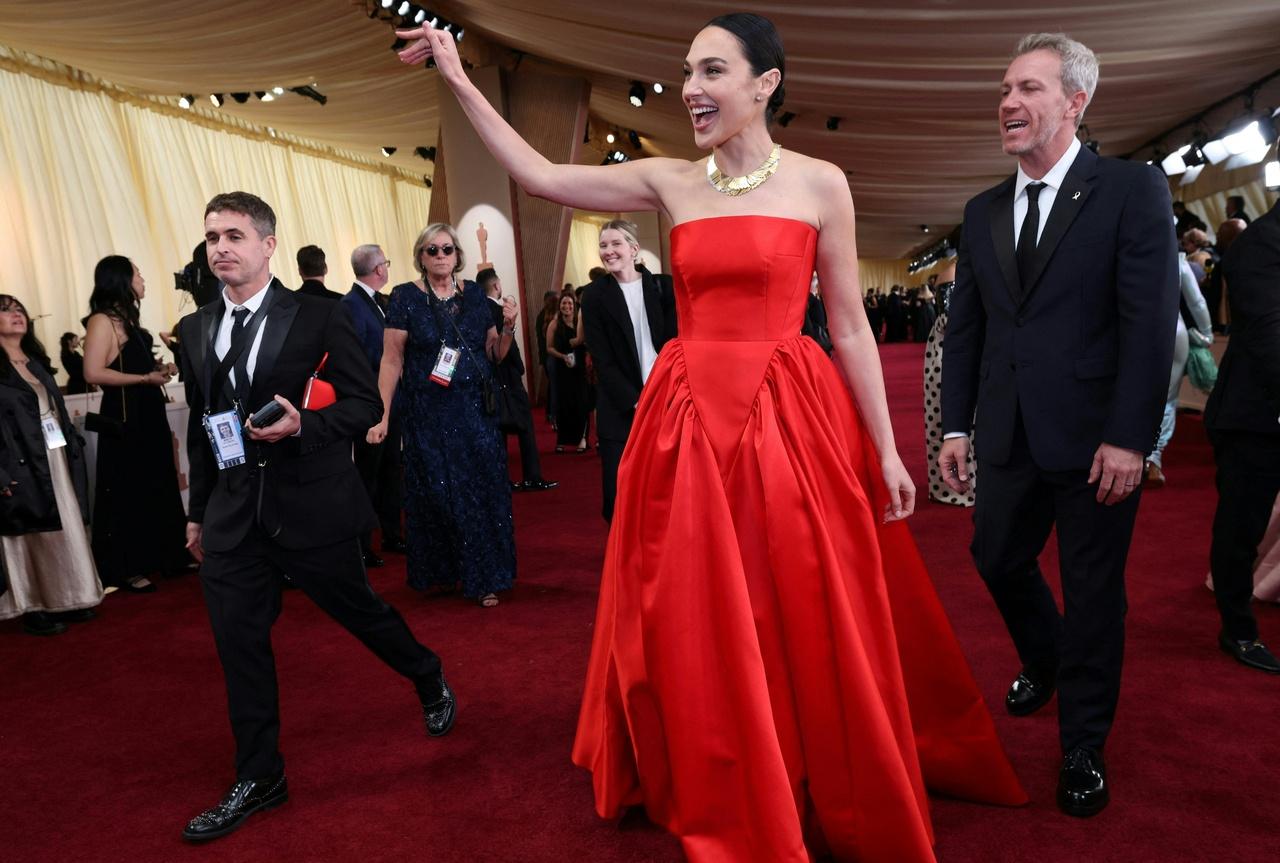 Wonder Woman star Gal Gadot stunned in a red strapless gown by Prada. 